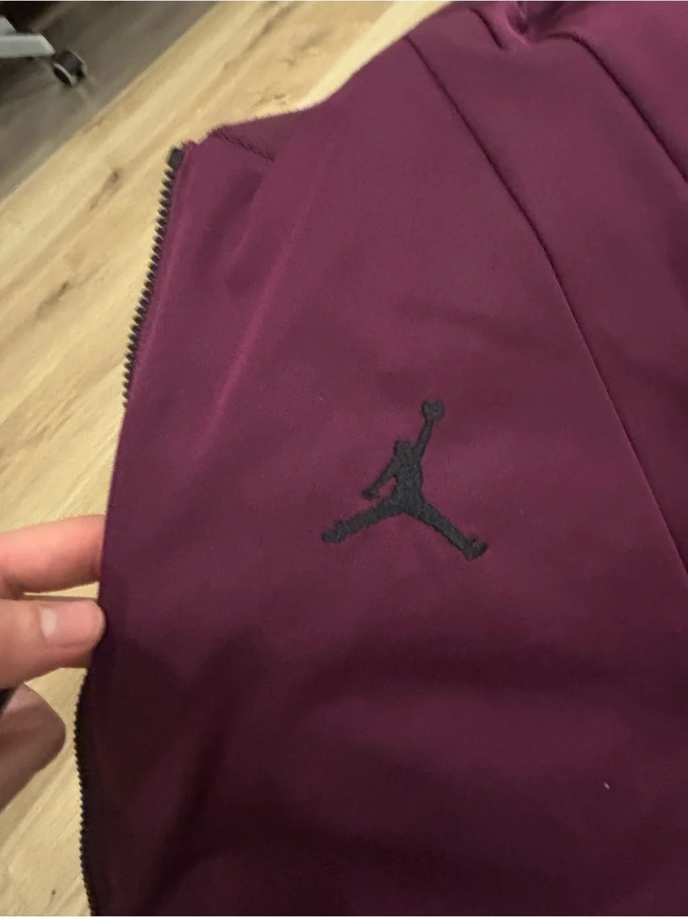 Classic Jordan Sportswear Wings MA-1 jacket features a burgundy wine colorway